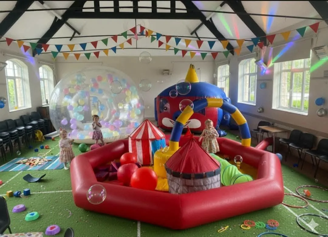 A colourful indoor sensory party with bubble house and play equipment
