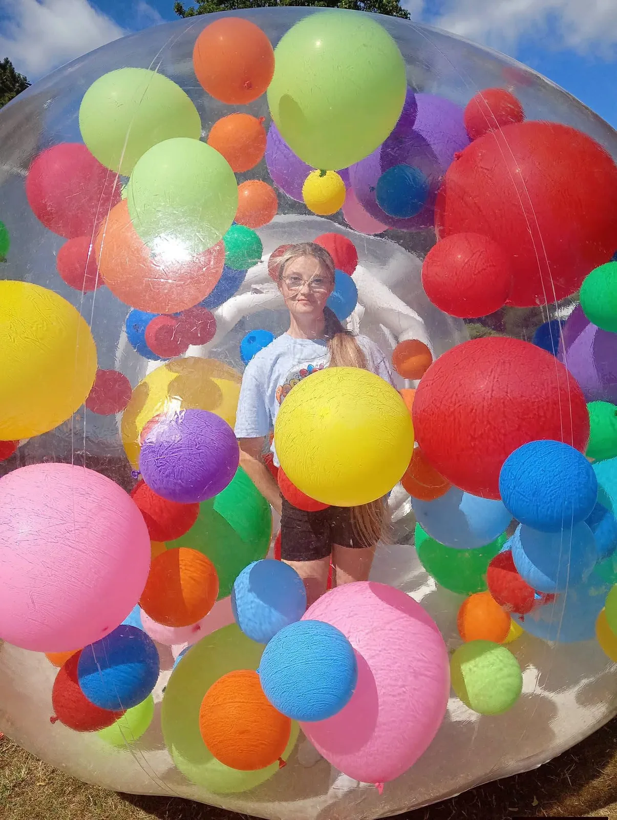 A bubble house filled with colourful balloons